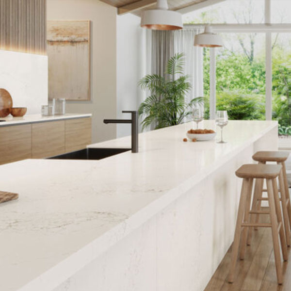 Kitchen island | Modern kitchen with Caesarstone quartz countertop in Cloudburst Concrete finish